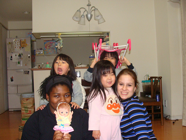 Lena Rogers with a classmate and her host family's kids and neighbors